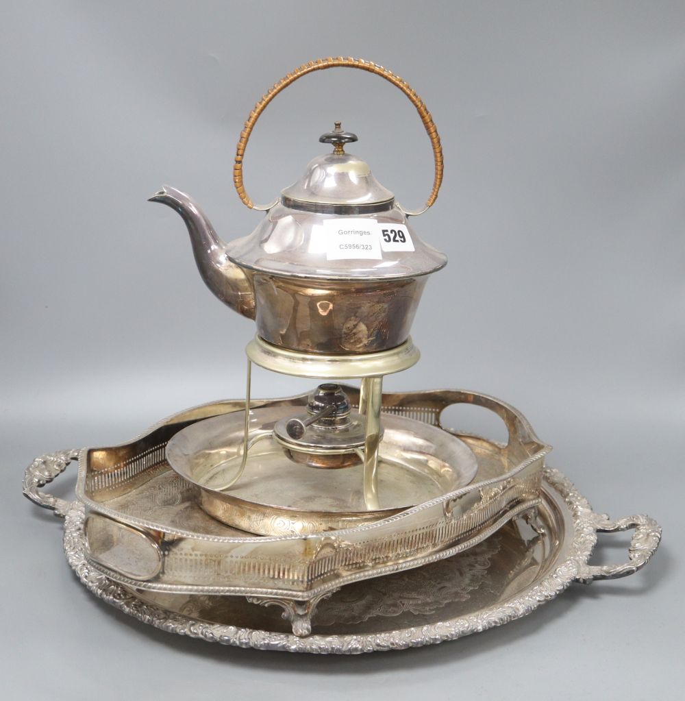 A plated kettle on spirit stand, height 35cm and two plated trays